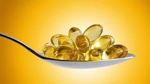 Капсулы рыбьего жира в ложке